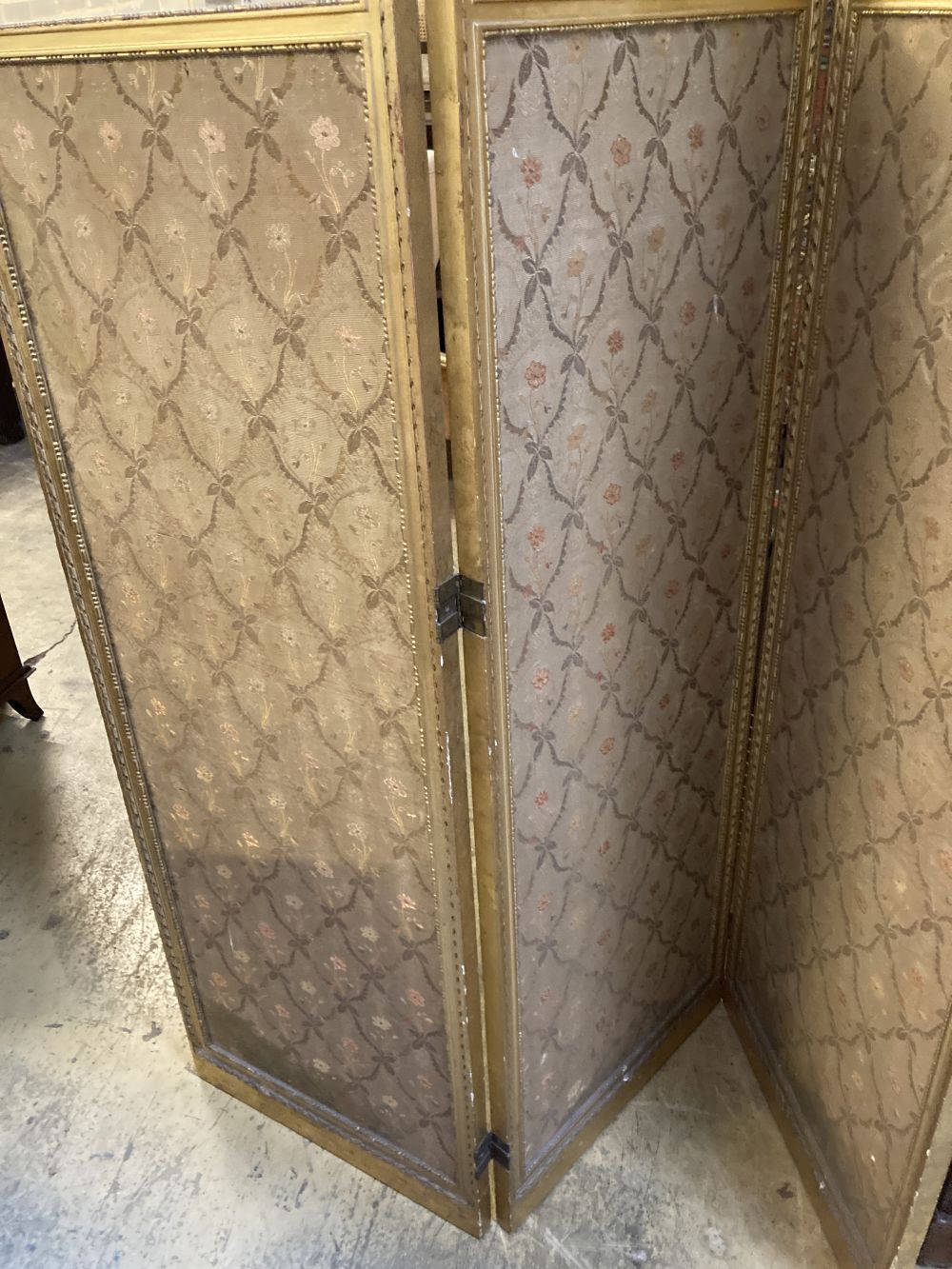 A Louis XVI style carved giltwood three-fold dressing screen, each panel width 47cm, height 182cm
